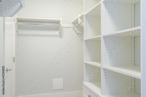 Empty closet, working closet, cupboard in bedroom.