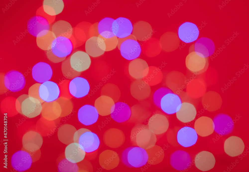 multicolored bokeh on red background