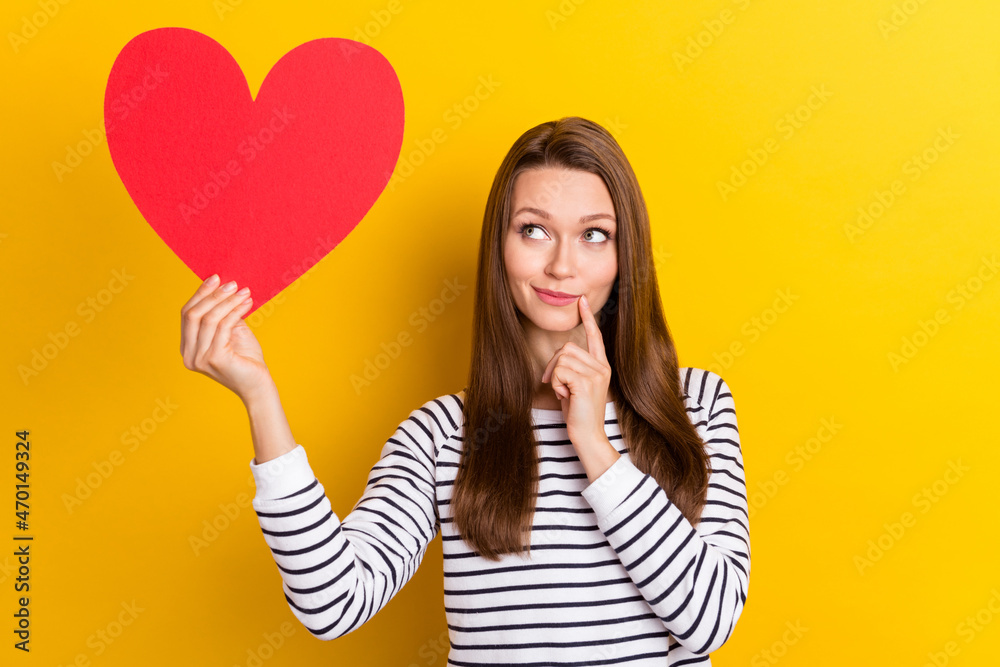 Photo of think brunette young lady look heart wear white pullover isolated on yellow color background Photo of think brunette young lady look heart wear white pullover isolated on yellow color background