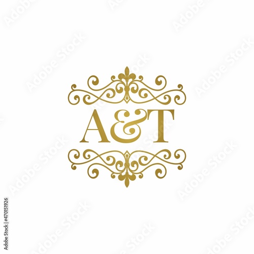 A&T initials logo ornament gold. Letter AT wedding ampersand or business partner symbol.