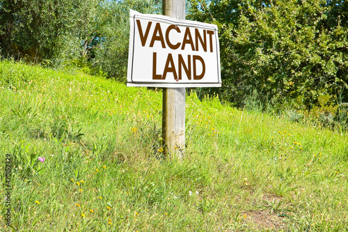 Building lot on hilly land - Land plot management - Real estate concept with a vacant land on a green field available for building construction and housing subdivision in a residential area