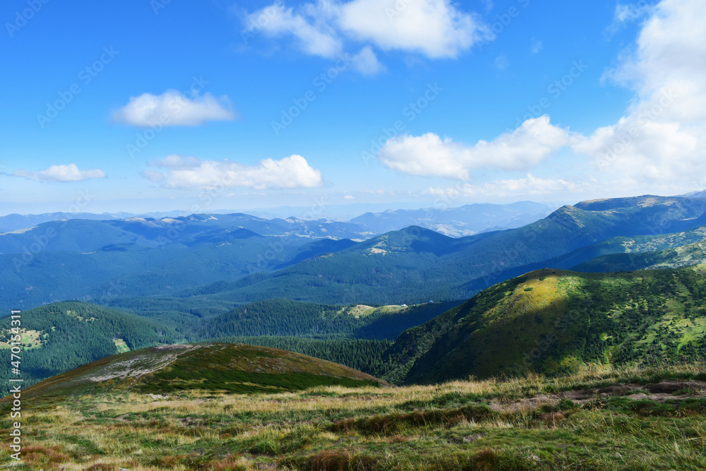 Picturesque meadows with hills in Carpathian mountains in sunny summer day. Wonderful nature of mountains. Picturesque meadows with hills in Carpathian mountains in sunny summer day. Wonderful nature of mountains.