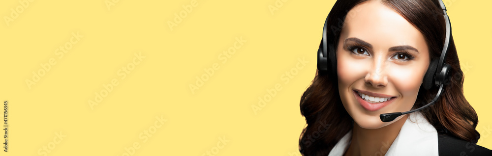 Call center. Face portrait of customer support phone advertiser sales operator in headset. Businesswoman or female phone worker, yellow color background. Answering service centre agent. Call center. Face portrait of customer support phone advertiser sales operator in headset. Businesswoman or female phone worker, yellow color background. Answering service centre agent.