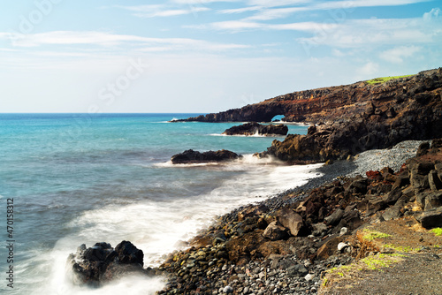 a lone river rock-strewn shoreline along Maui's Southeastern coastline. 