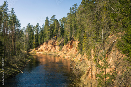 Nelku red sandstone cliffs at the river Salaca in Mazsalaca photo