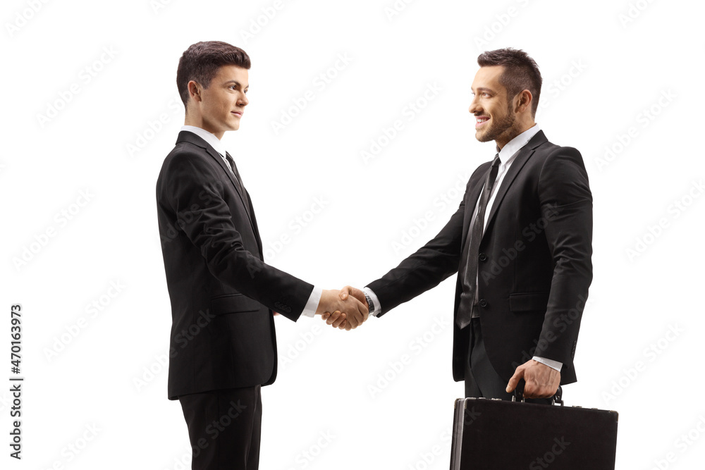 Guy in a suit shaking hands with a businessman Guy in a suit shaking hands with a businessman
