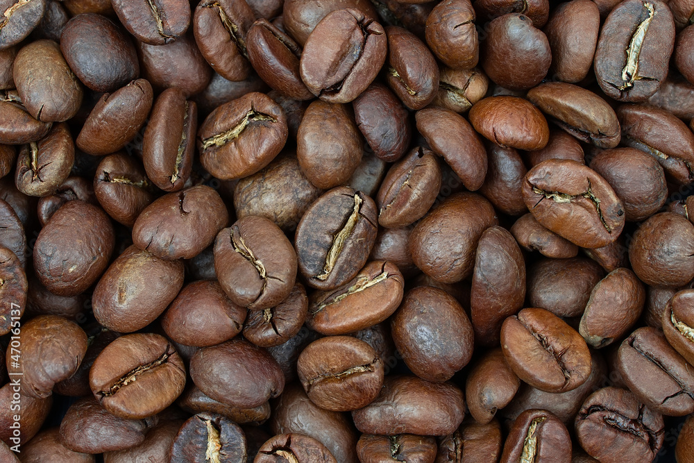 Fototapeta premium Coffee beans background. Background of roasted coffee beans.