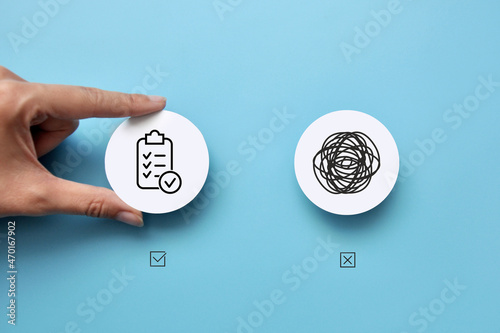 Two paper circles with a pattern of confusion on one and a clear line on the other. A person chooses clarity of thinking