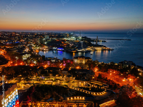 Fototapeta Naklejka Na Ścianę i Meble -  Night Sevastopol skyline, aerial view of the Sevastopol bay and embankment