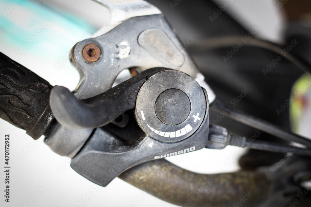 Shimano tension controller on bicycle handle. Shimano tension controller on bicycle handle.