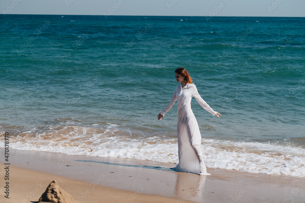woman silhouette walks along the coast landscape ocean Fresh air woman silhouette walks along the coast landscape ocean Fresh air