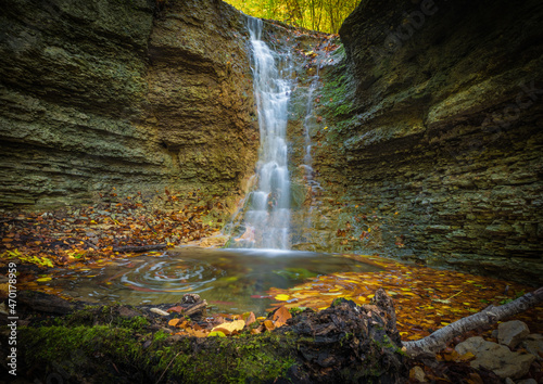 A small waterfall in rautal close to jena in thuringia at autumn photo
