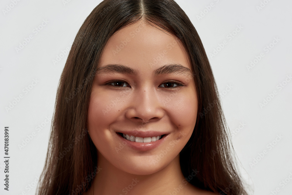 Smiling Asian woman show heathy white teeth