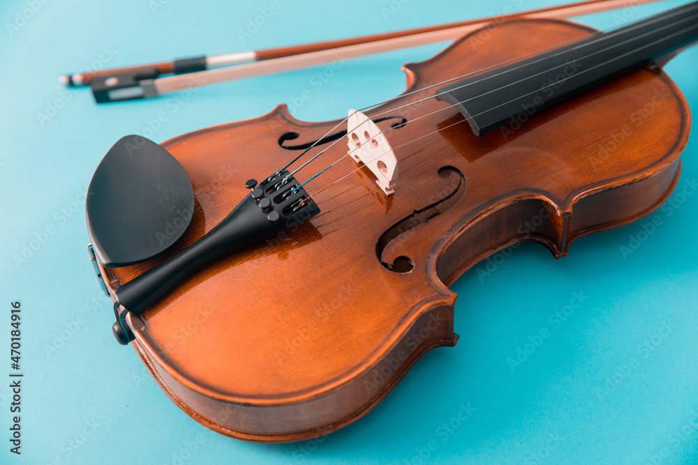 Violin isolated on blue background Violin isolated on blue background