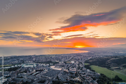 Aerial view of Holyrood Park is the largest of Edinburgh's royal parks. Edinburgh's Holyrood Park popular tourist destinations in the city. People enjoy the beautiful lakes, ponds, natural woodlands © Damian