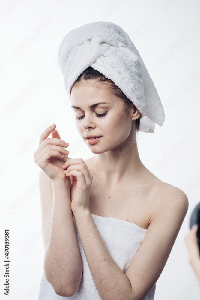 woman after shower with towel on head posing skin care woman after shower with towel on head posing skin care