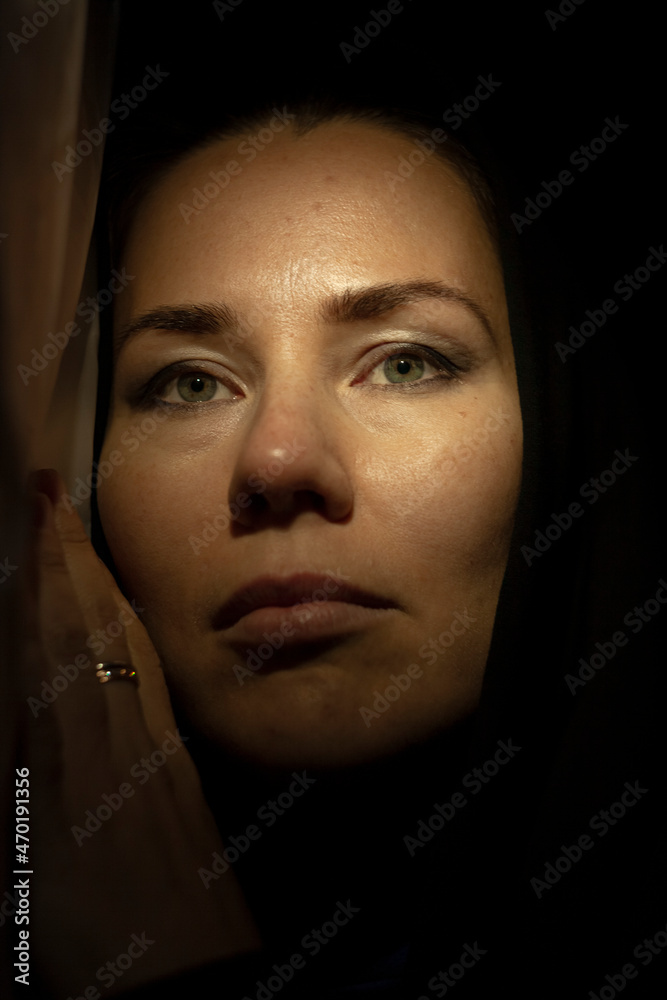 Portrait of a young woman in the shade close up Portrait of a young woman in the shade close up