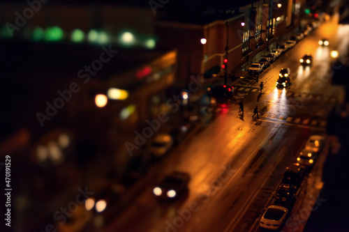 Fototapeta Naklejka Na Ścianę i Meble -  Creative Imagine from Above Small People Cars transportation Nighttime Photography Night Lights After Dark 