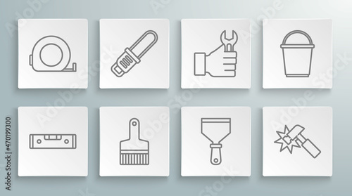 Set line Construction bubble level, Chainsaw, Paint brush, Putty knife, Hammer, Wrench spanner, Bucket and Roulette construction icon. Vector