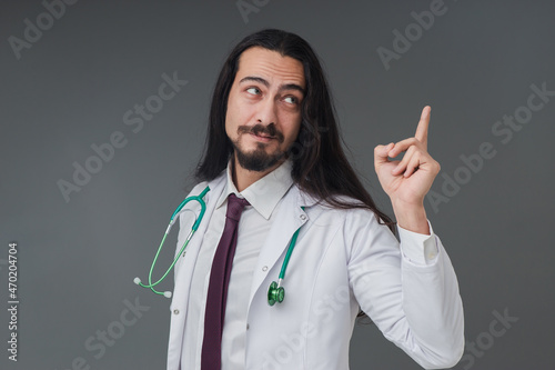 Amazed young male Italian handsome doctor   s Gesturing be caution sign  studio shot includes copy space.