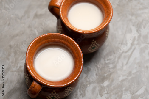 Mexican fermented beverage called pulque on a gray background photo