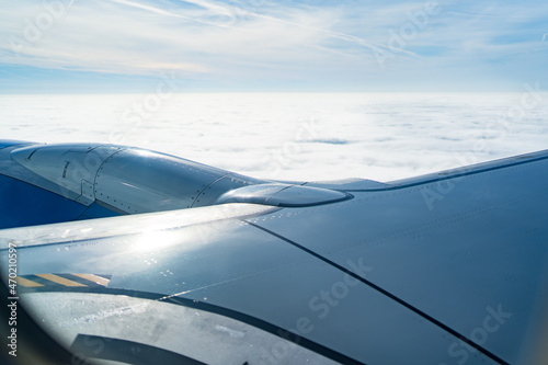 the engine and wing of the aircraft in flight from the window of the aircraft. 