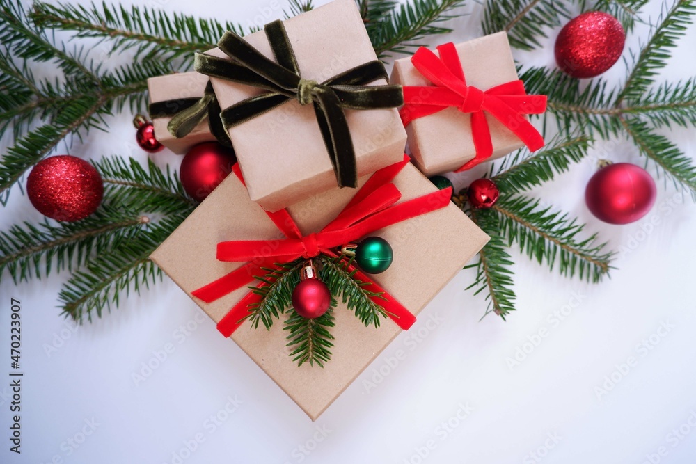 Christmas background with gift boxes and ornaments in white color. Xmas celebration, greetings, preparation for winter holidays. Festive mockup, top view, flat lay with copy space. Christmas background with gift boxes and ornaments in white color. Xmas celebration, greetings, preparation for winter holidays. Festive mockup, top view, flat lay with copy space.