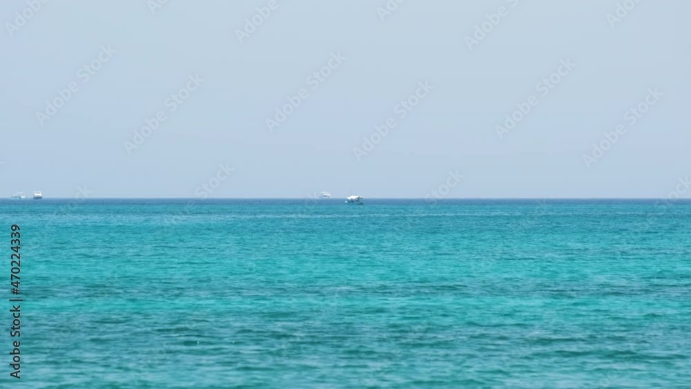 Closeup seascape surface of blue sea water with small ripple waves Closeup seascape surface of blue sea water with small ripple waves