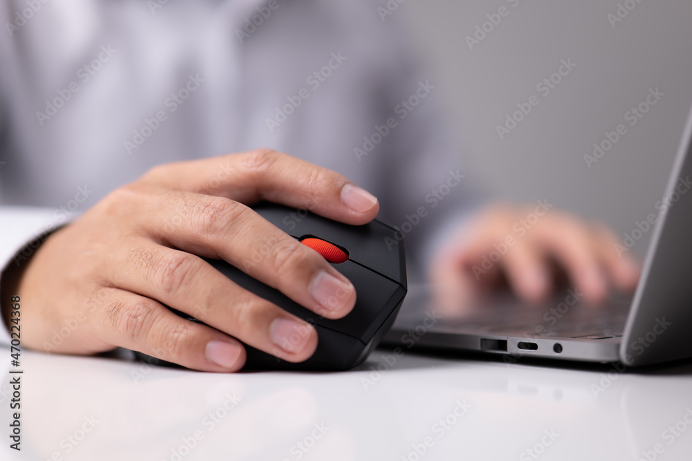 Man hand uses a vertical ergonomic computer mouse joystick. Man hand uses a vertical ergonomic computer mouse joystick.