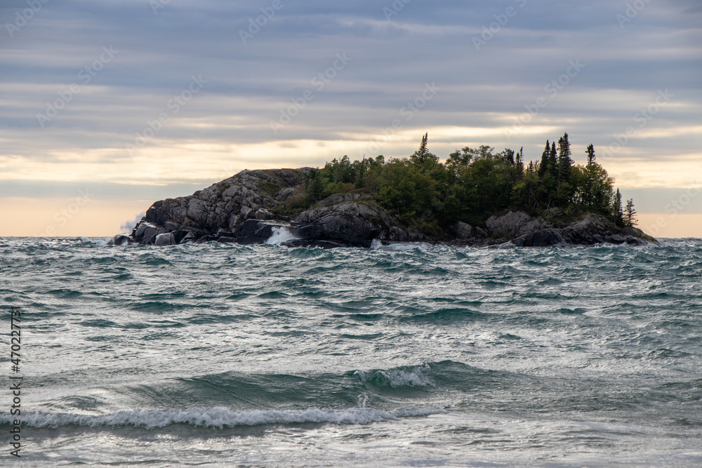 waves crashing on a small island in Lake Superior