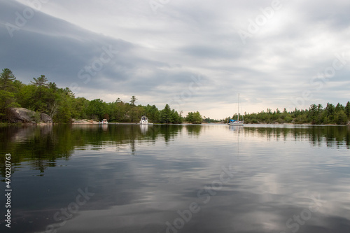 Boats anchored on a tranquil bay at Georgian Bay Islands National Park photo