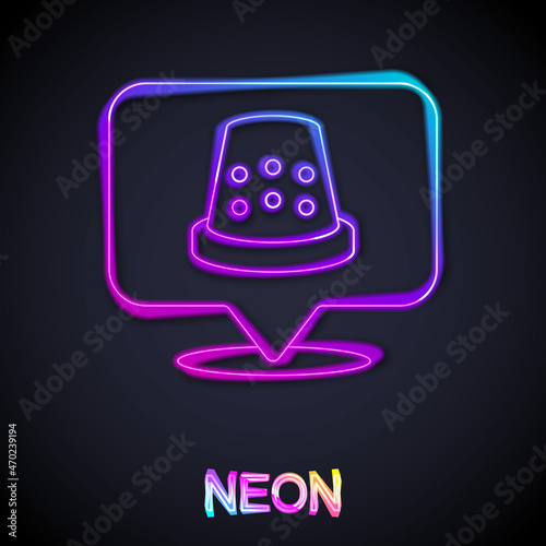 Glowing neon line Thimble for sewing icon isolated on black background. Vector
