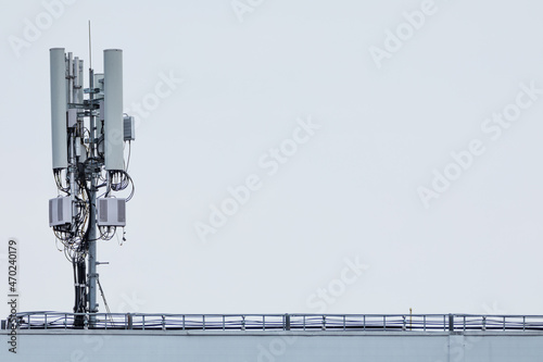Telecommunication 5g tower on a background of blue sky.