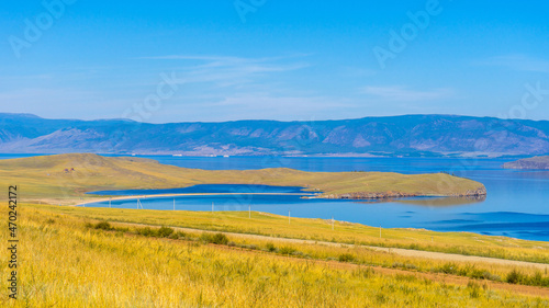 View from Olkhon island to Maloe More strait of lake Baikal and mainland near Yalga village. Picturesque summer landscape, beautiful natural background. Discovering distant places of Earth