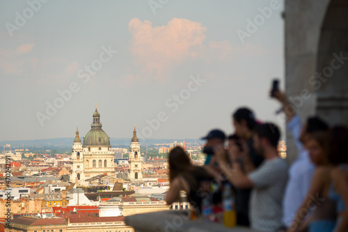 Blurred group of people taking pictures of St. Stephen's Basilica in Budapest