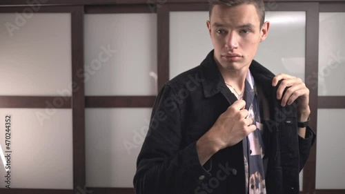 Portrait Of A Confident Young Man Wearing Black Corduroy Jacket. Medium Shot photo