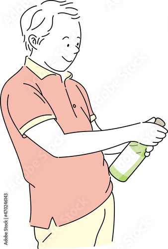 ワインボトルの栓を抜こうとする笑顔の若い男性