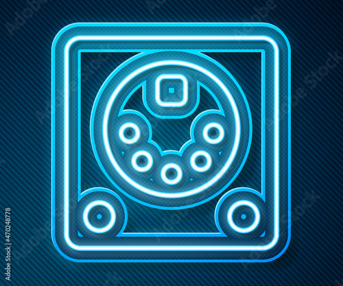 Glowing neon line Drum machine icon isolated on blue background. Musical equipment. Vector