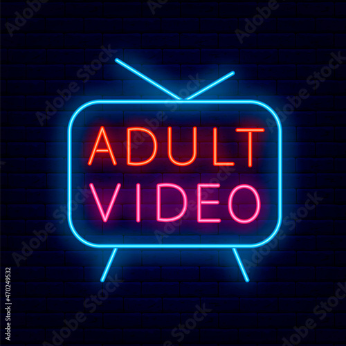 Adult video neon sign on brick wall background. Night bright promotion.Editable stroke. Vector stock illustration
