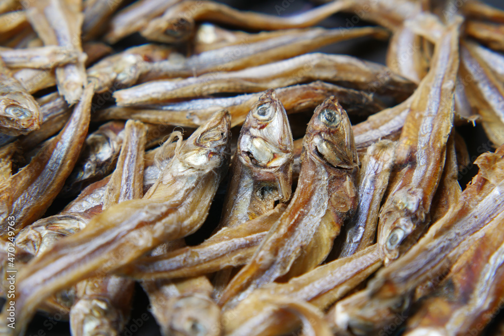 close up of dried fish on blue backgrund 