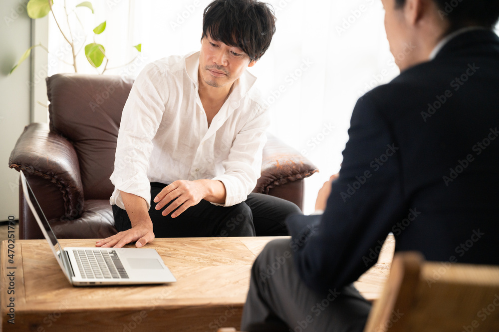 Image of a Japanese (Asian) who looks like a representative of the office talking to a salesperson Close-up Copy Space Image of a Japanese (Asian) who looks like a representative of the office talking to a salesperson Close-up Copy Space