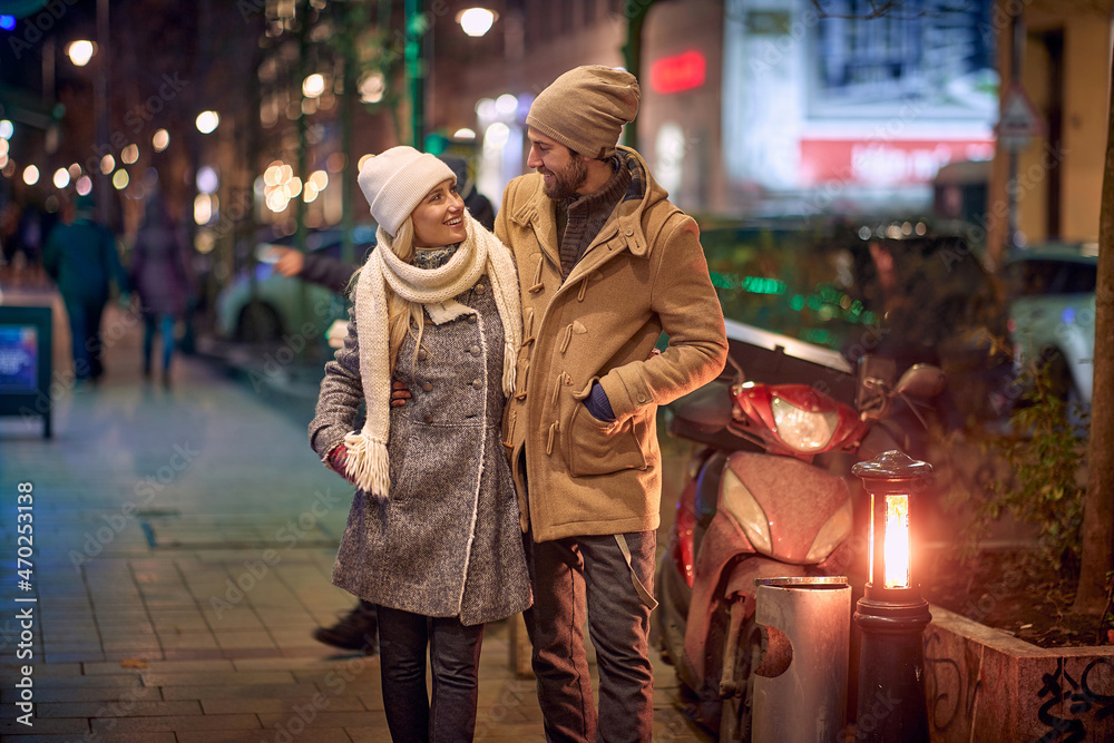 couple on a romantic walk around a decorated city