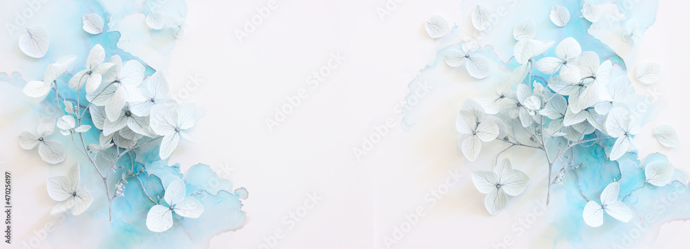 Creative image of pastel blue Hydrangea flowers on artistic ink background. Top view with copy space - obrazy, fototapety, plakaty 