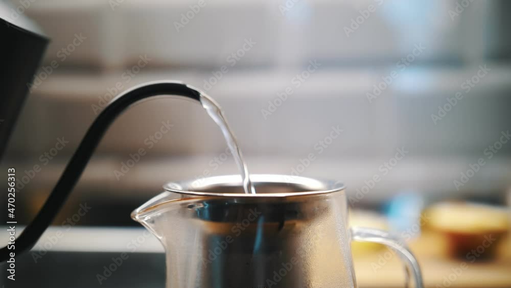 herbal tea. tea drink. preparation of herbal tea. close-up. process of brewing chamomile tea. chopped dry chamomile is poured with boiling water in a teapot