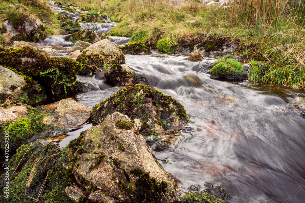 Small waterfall in a mountains. Beautiful nature scenery. Calm and peaceful atmosphere. Small waterfall in a mountains. Beautiful nature scenery. Calm and peaceful atmosphere.