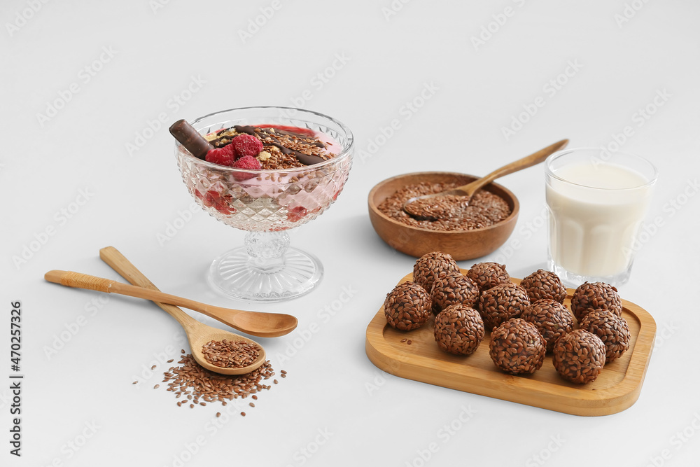 Tasty desserts with flax seeds on white background Tasty desserts with flax seeds on white background