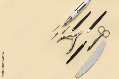 Manicure instruments on color background
