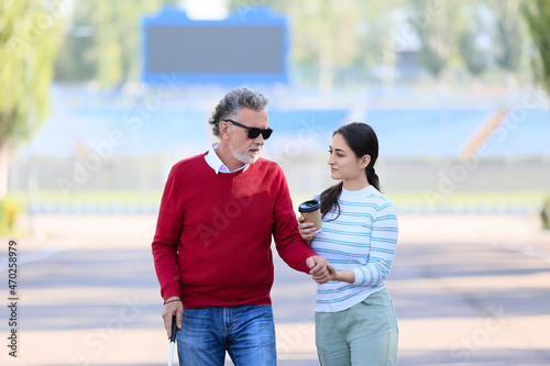 Blind senior man with his d...