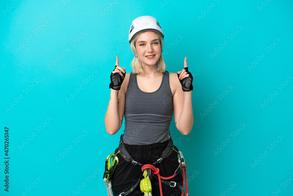 Young caucasian rock-climber woman isolated on white background pointing up a great idea Young caucasian rock-climber woman isolated on white background pointing up a great idea