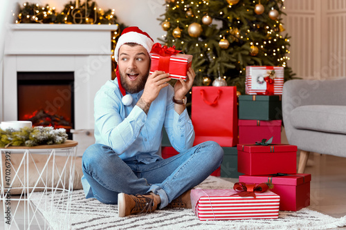 Handsome man with gifts at ...